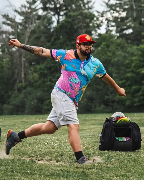 Tets throwing a drive at a disc golf tournament